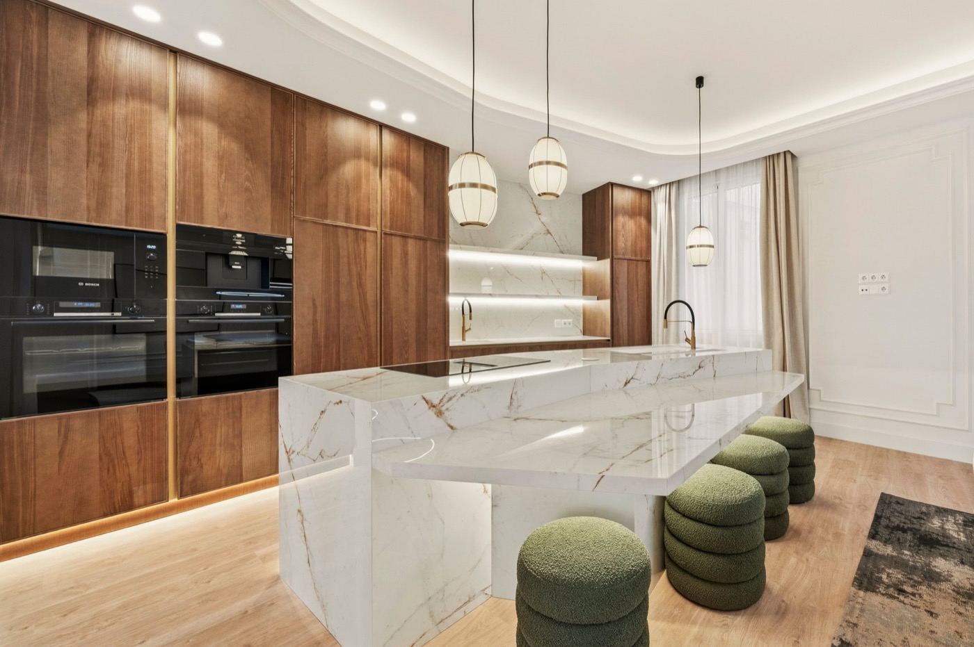 Marble kitchen island with walnut cabinetry