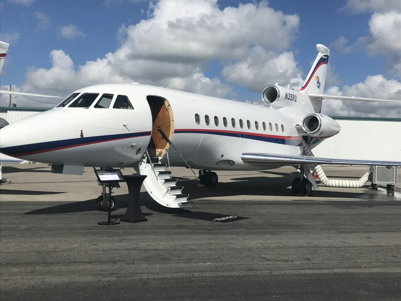 Private jet with stairs open on the tarmac