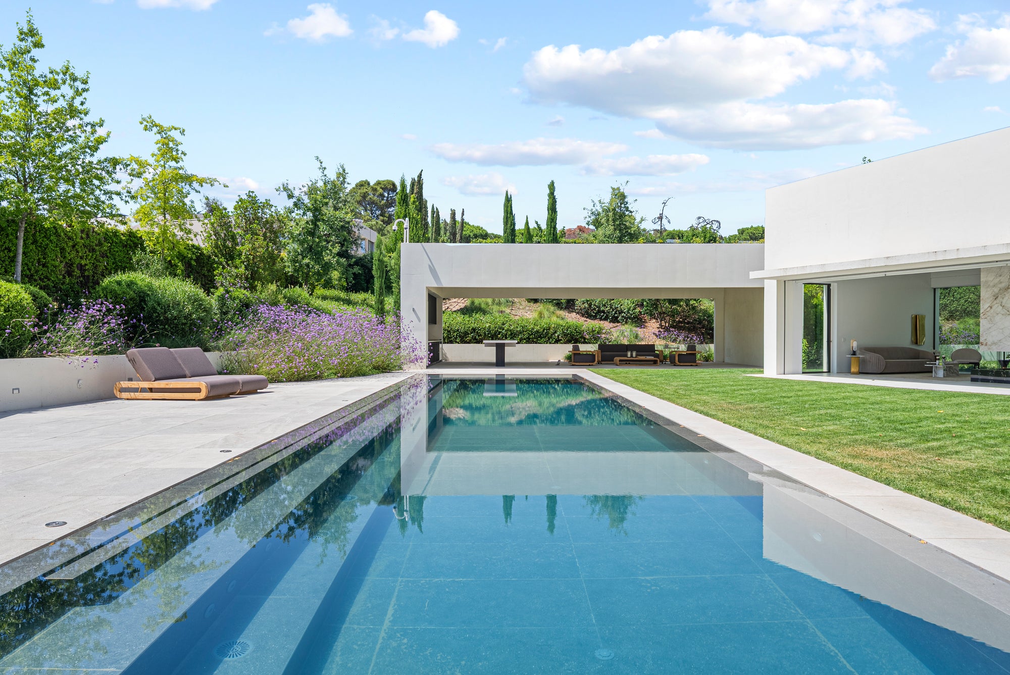 Sculptural pool pavilion with lavender garden