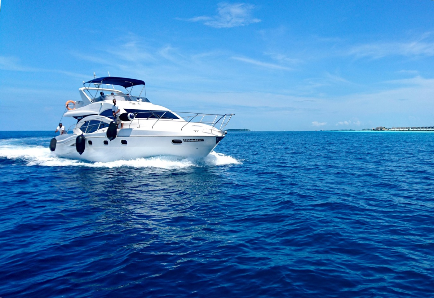 Motor yacht underway over blue water